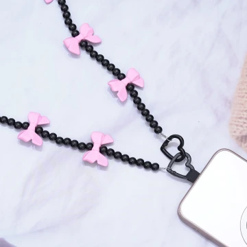 黑珠桃粉蝴蝶結×手機斜背雙勾掛繩.avif