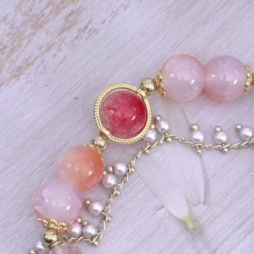 璨金琉璃橘晶粉殼花×固定式串珠手鍊.avif