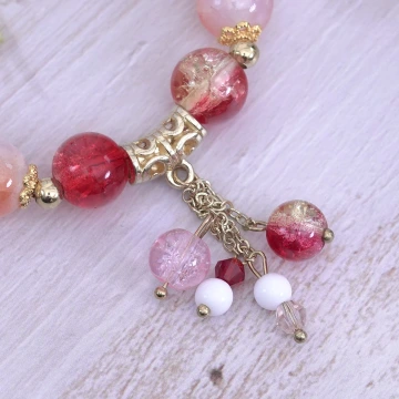 璨金琉璃橘晶粉殼花×固定式串珠手鍊.avif