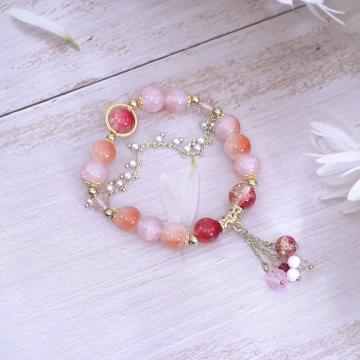 璨金琉璃橘晶粉殼花×固定式串珠手鍊.avif