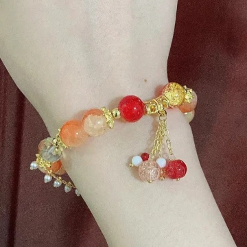 璨金琉璃橘晶粉殼花×固定式串珠手鍊.avif
